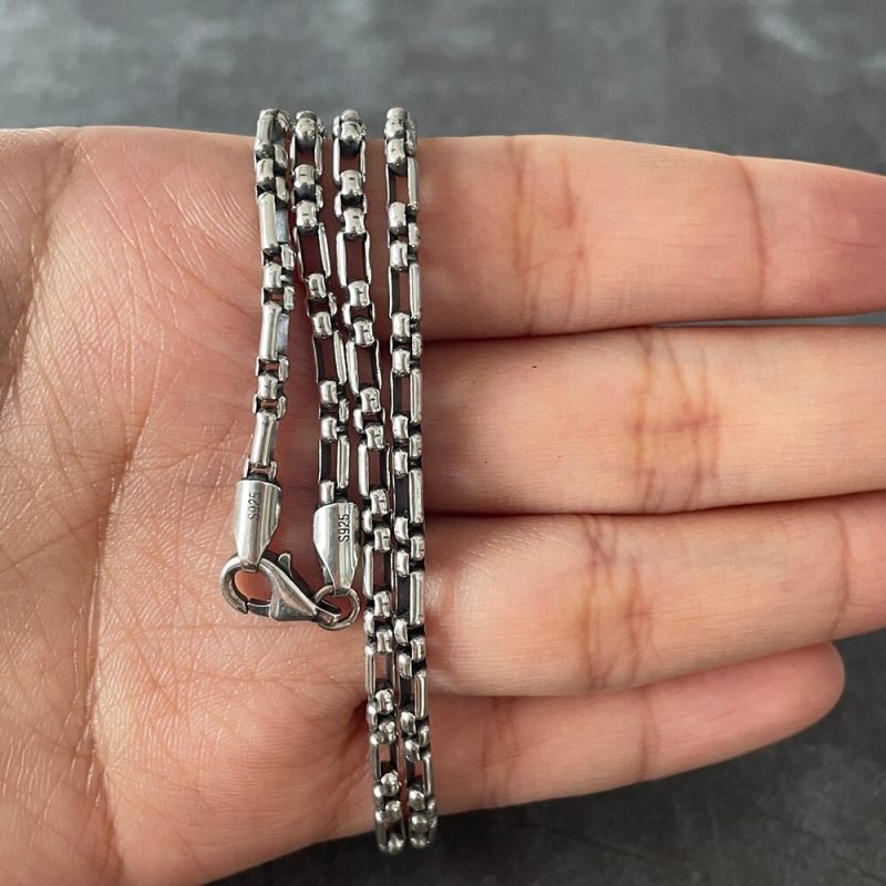 Alternate Link Silver Necklace around hand