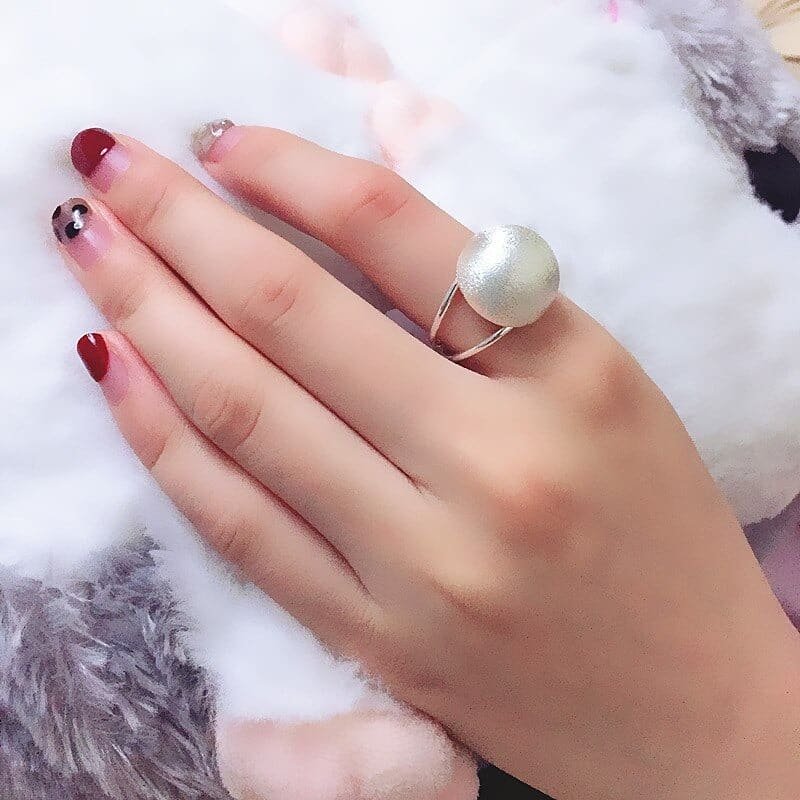 Silver Ball Ring on finger