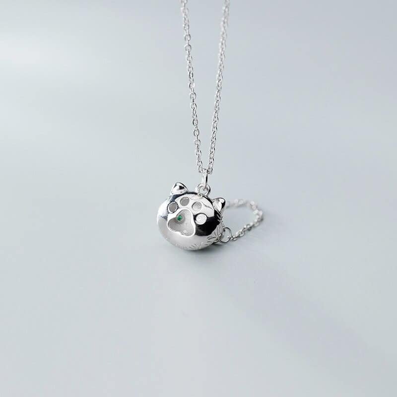 Sterling Silver Cat Face Pendant With Gemstone Eyes back view and paw
