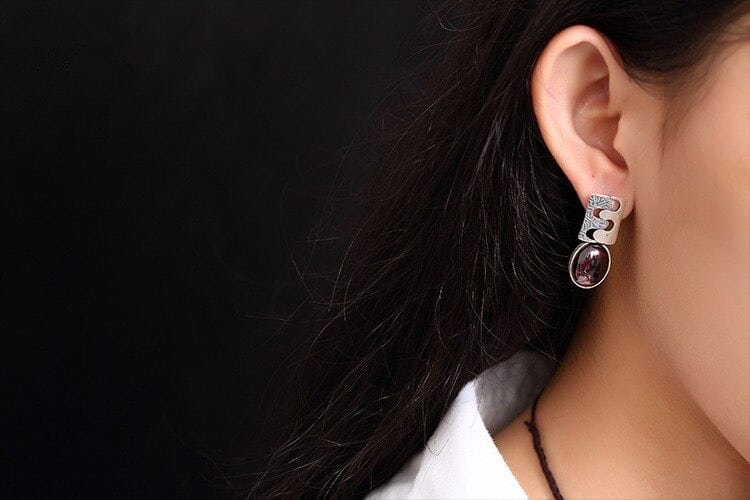 Sterling Silver Drop Earrings With Red Stone on ear