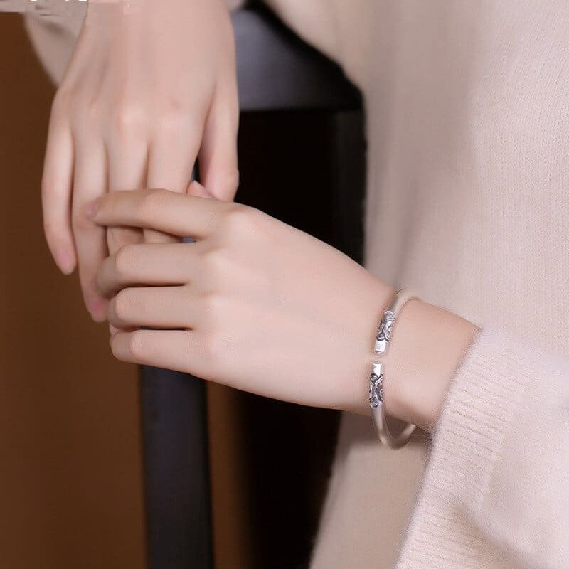 Women Cloud Silver Bracelet around wrist
