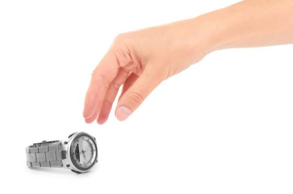 silver watch on woman wrist