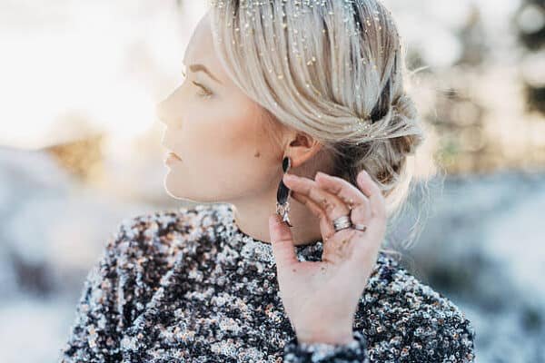 woman wearing silver earrings 999